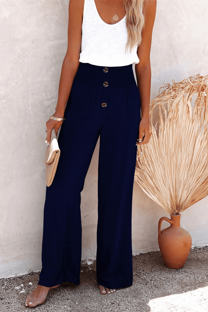 Modern women's wide leg pants, loose fit & elegant for summer, styled with a sophisticated button closure.