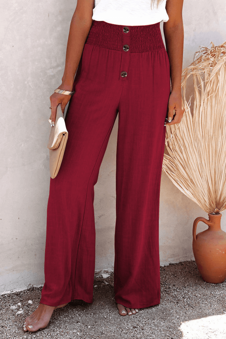 Comfortable loose fit wide leg pants for women, elegant polyester design with button closure.