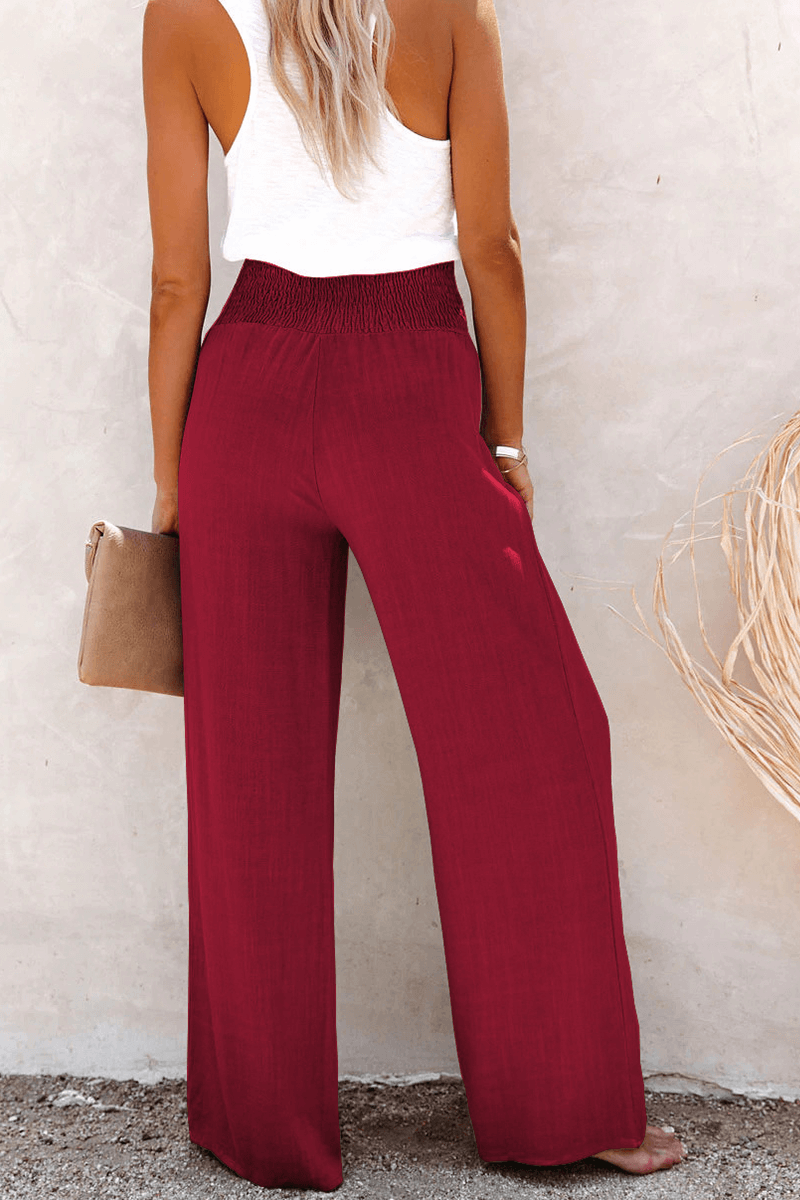 Versatile women's wide leg trousers, perfect for casual or elegant looks, featuring a neat button closure.