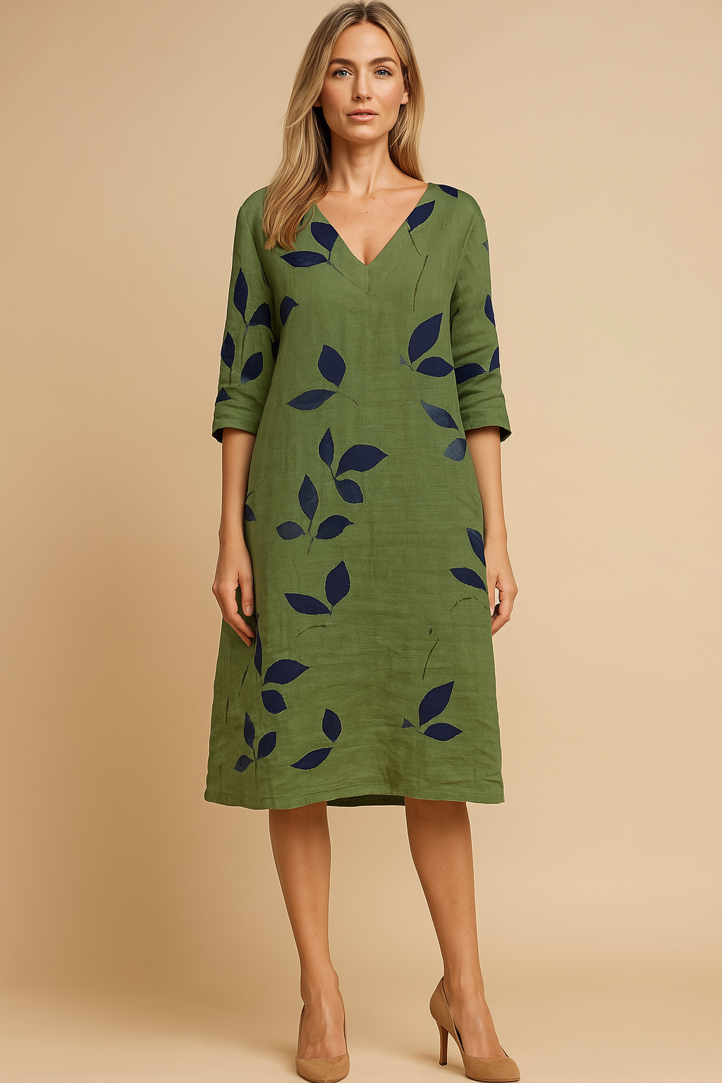 Women's Eliza flowy summer dress with elegant leaf print, V-neck, and 3/4 sleeves. Perfect casual knee-length vacation dress.
