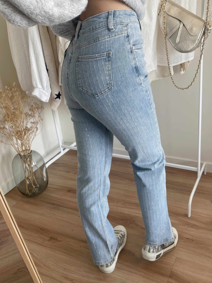 Back view of women's straight leg jeans with embellished details, perfect modern casual bottoms.