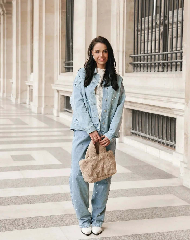 Women's embellished straight leg jeans, stylish denim pants for a modern casual outfit.