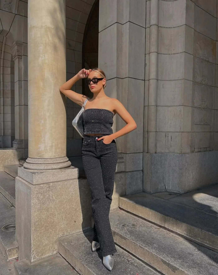 Straight leg women's jeans with unique embellishments, showcasing modern style and comfort.