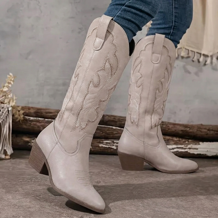 Embroidered cowgirl boots for women. Features a distinctive pointed toe and practical block heel.