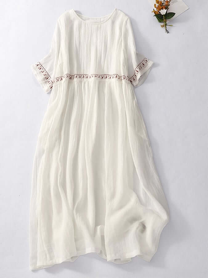 Casual yet elegant women's embroidered cotton linen dress, great for summer or vacation.