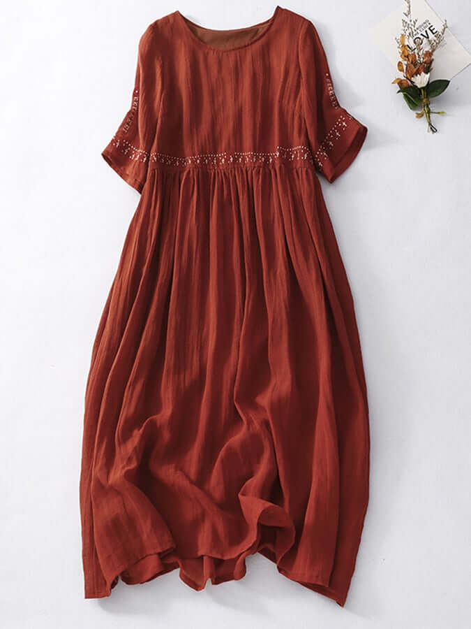 Women's loose cotton linen summer dress featuring intricate embroidery, a breezy boho style.