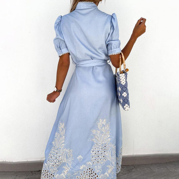 Light blue flowing maxi dress with intricate embroidery, comfortable and chic for summer beachwear.