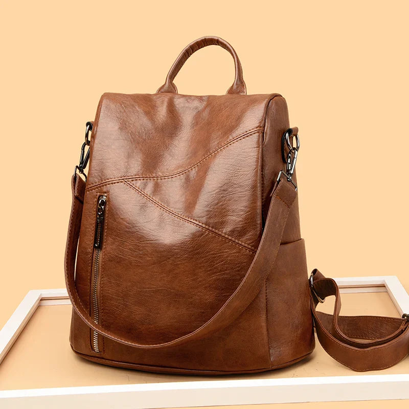 Side view of a structured faux leather backpack, chic everyday bag for women's fashion.