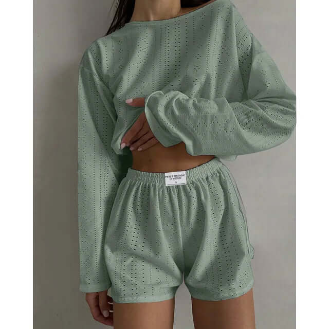 Breathable eyelet knit women's lounge set. Soft crop top & high-waisted shorts for relaxed comfort.