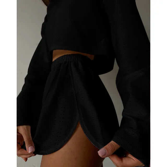 Stylish women's eyelet knit two-piece set. Relaxed fit crop top & high-waisted shorts for summer.