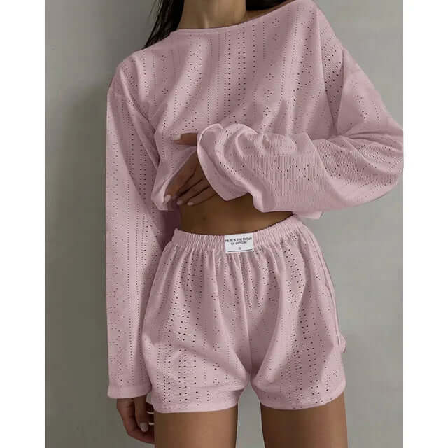 Casual summer women's lounge set. Eyelet knit crop top & high-waisted shorts, perfect for warm days.