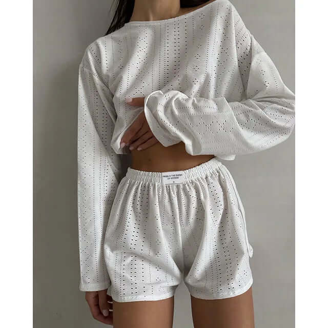 Women's eyelet knit crop top & high-waisted shorts lounge set. Comfortable, breathable summer fashion.