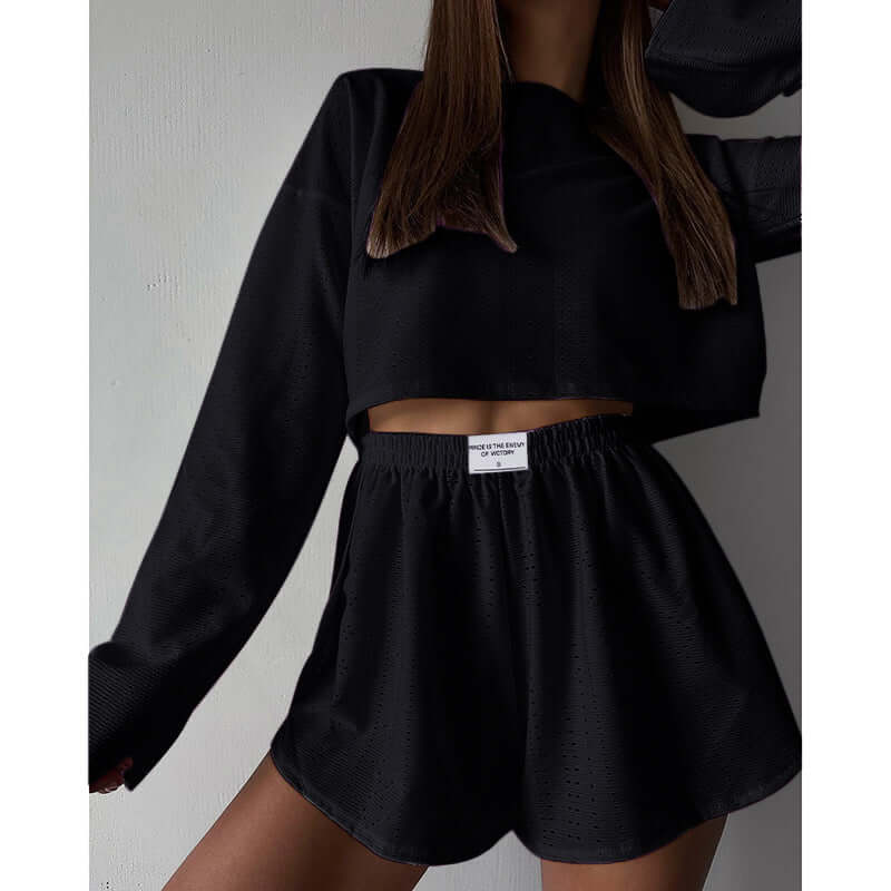 Delicate eyelet knit women's lounge set. Features a comfy crop top & flattering high-waisted shorts.