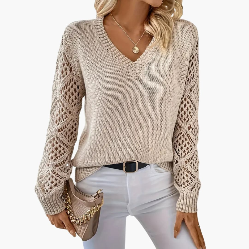 Women's fine knit V-neck sweater with long sleeves, perfect for casual everyday wear.