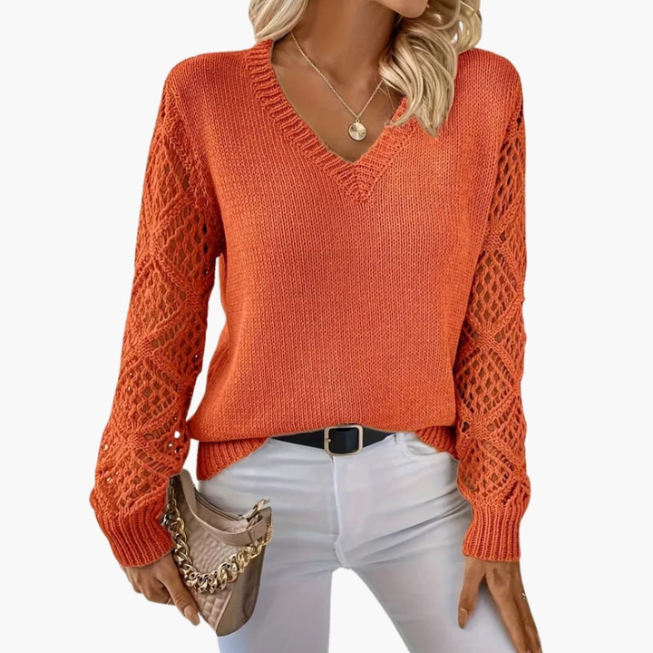 Soft, textured fine knit V-neck sweater for women with long sleeves. A versatile layering piece.