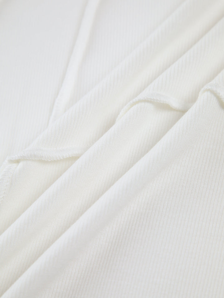 Sleek women's fitted long sleeve top featuring elegant raised seams, ideal for casual elegant or structured layering.
