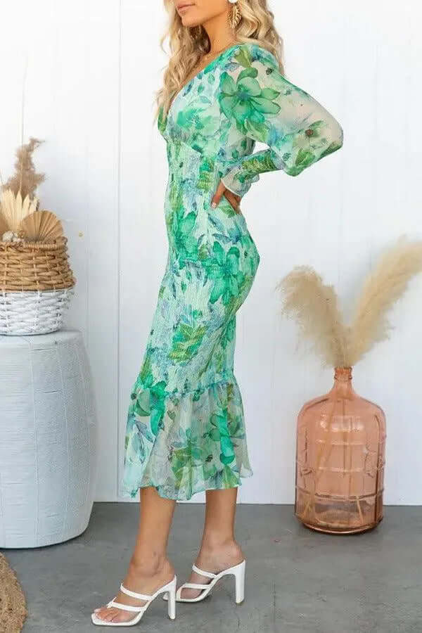 Feminine women's midi dress, fitted with chic puff sleeves, V-neck, and stylish ruffled hem for a flattering look.