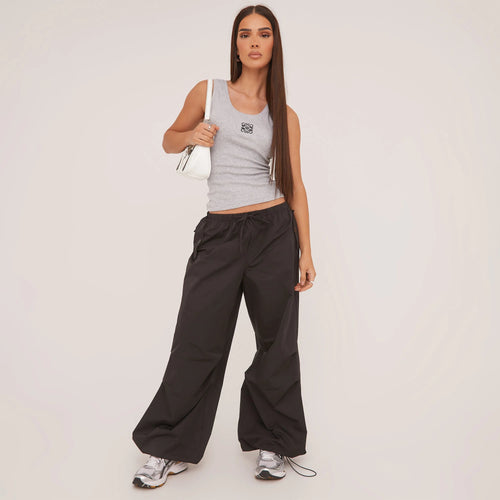 White women's racerback tank top, a comfortable fitted sleeveless basic, perfect for summer fashion.