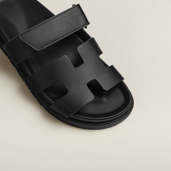 Modern design women's flat sandals, versatile slip-on casual footwear.