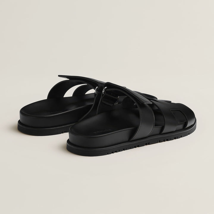 Chic women's flat sandals, easy slip-on design for casual summer wear.