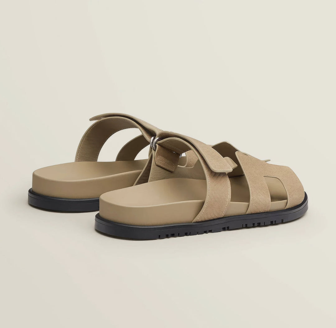 Summer ready women's flat slip-on sandals, modern and comfortable casual footwear.