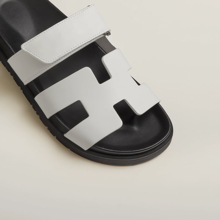 Stylish women's slip-on flat sandals, perfect for modern summer footwear.