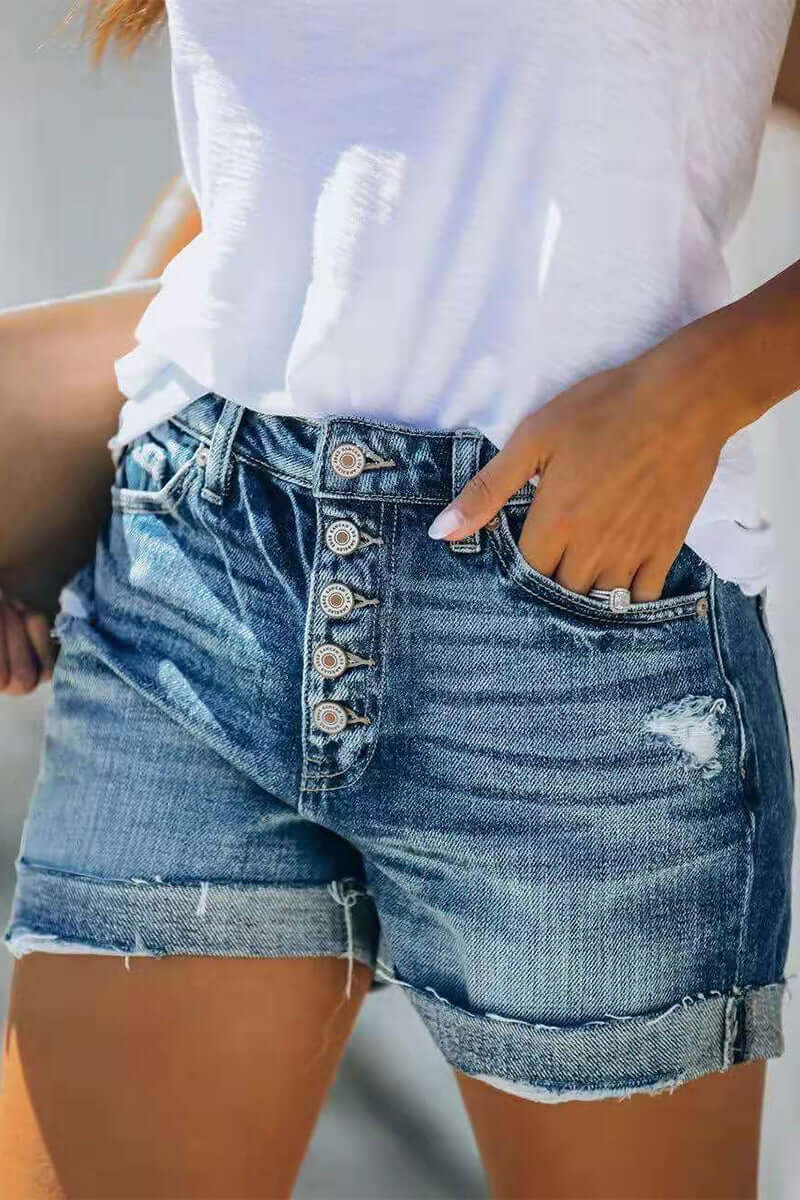 Stylish women's mid-rise denim shorts in blue, designed for a flattering fit & everyday comfort.