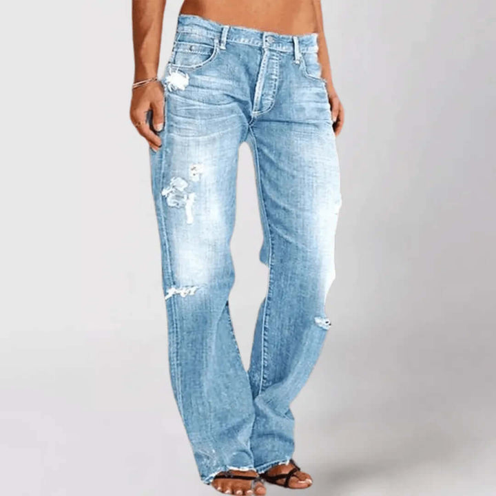 Women's distressed mid-rise stretch bootcut jeans. Casual & stylish denim for modern everyday fashion.