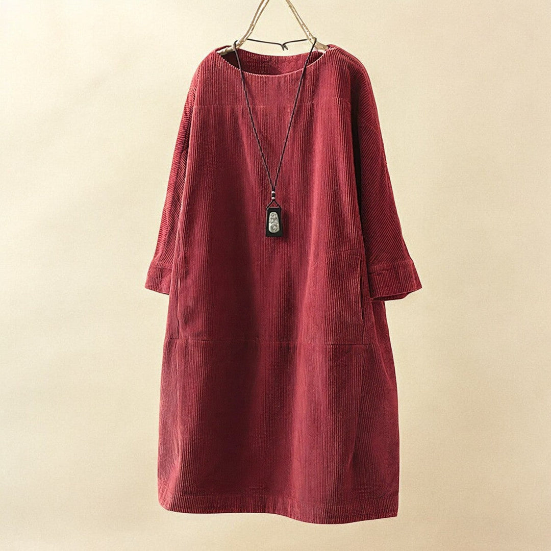 Flowy spring/summer women's dress, offering elegant style & comfortable tummy coverage.