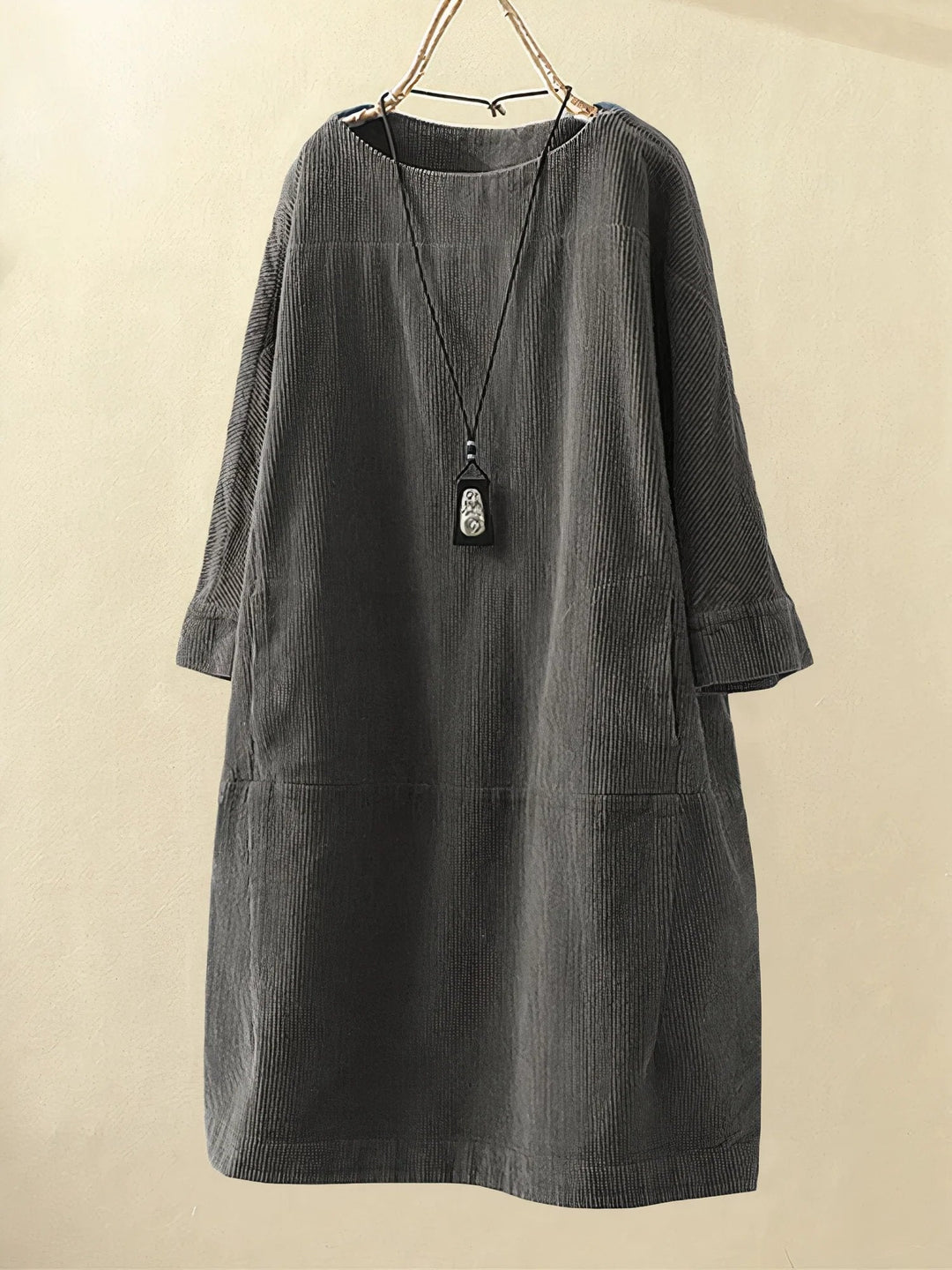 Chic women's dress, offers flattering tummy coverage, ideal for spring/summer elegance.