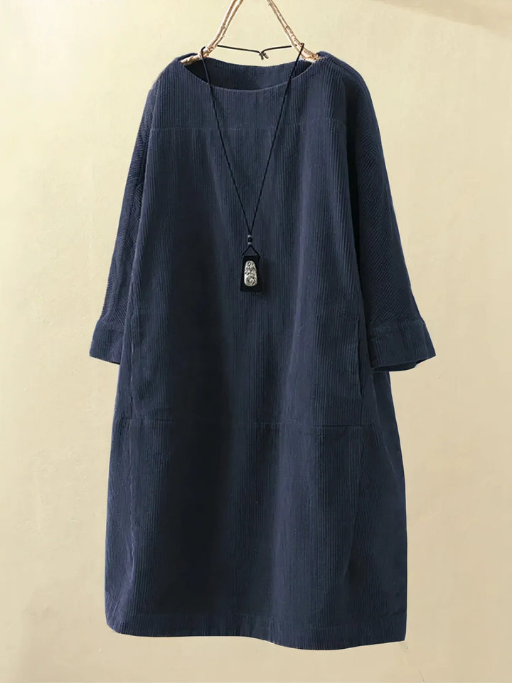 Stylish women's midi dress, comfortable and flattering, with effective tummy coverage.