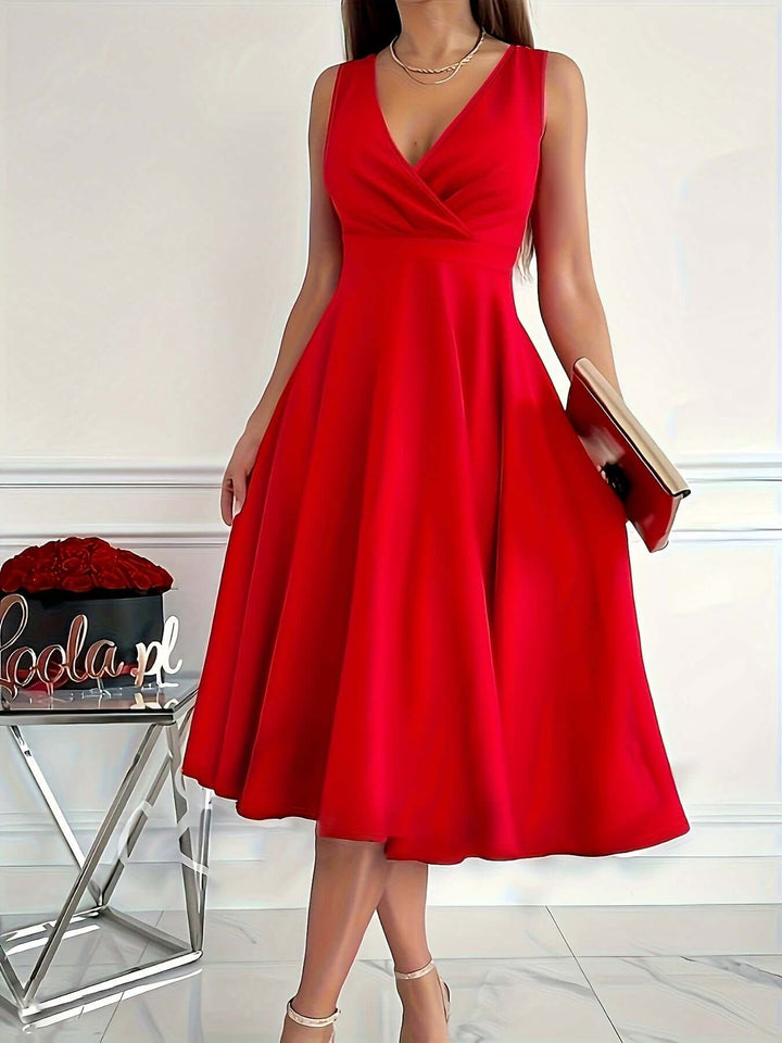 Women's flattering v-neck midi dress for elegant and versatile style.