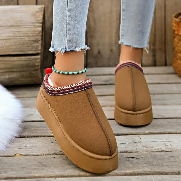 Easy slip-on women's mules with warm fleece lining, ideal casual footwear for quick indoor-outdoor transitions.
