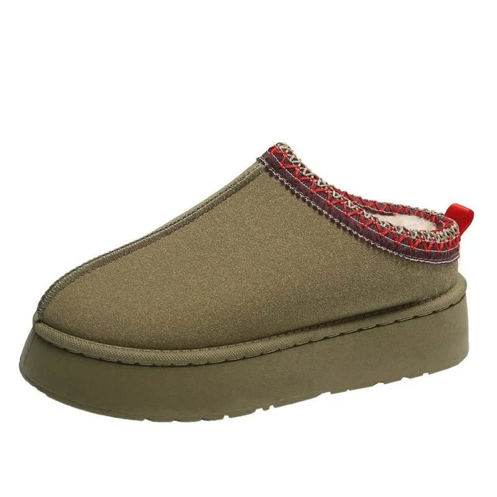 Women's cozy fleece-lined slip-on mules, providing essential warmth and comfort for chilly days and evenings.