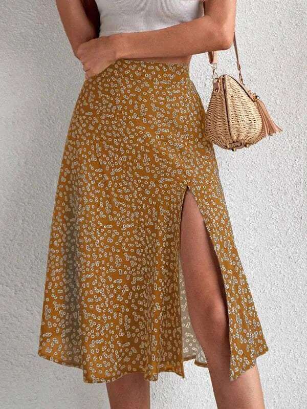 Flowy women's floral print A-line midi skirt featuring a chic side slit, great for a fashionable spring outfit.