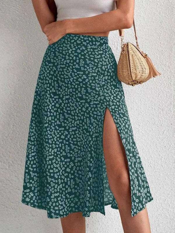 High-waisted women's floral A-line midi skirt with an elegant side slit. Dressy & flowy for spring & summer fashion.
