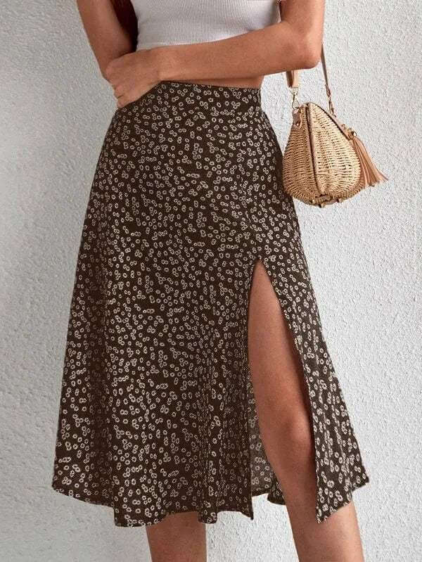 Chic women's floral midi A-line skirt with side slit. Versatile for casual or dressy spring/summer fashion looks.
