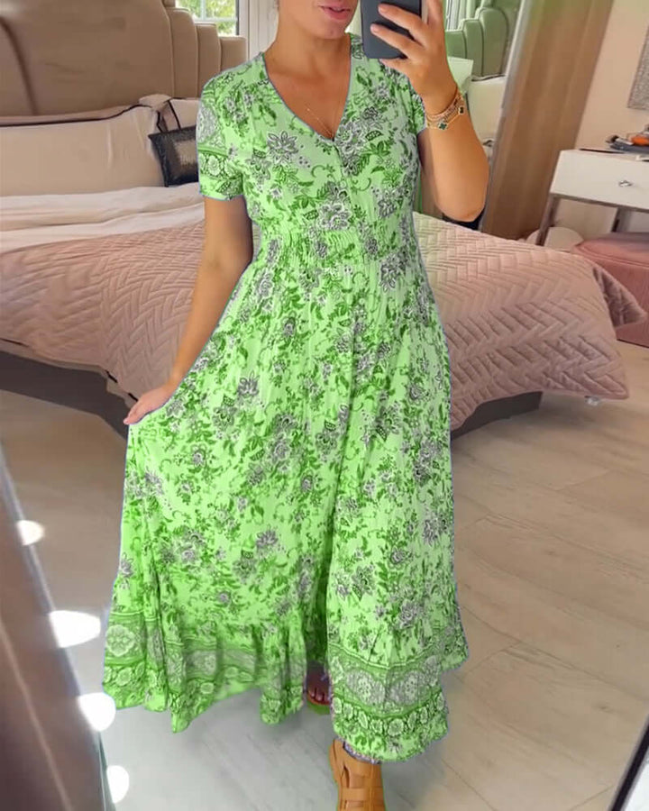 Women's floral boho maxi dress with V-neck, short sleeves, perfect for effortless summer style and vacation.