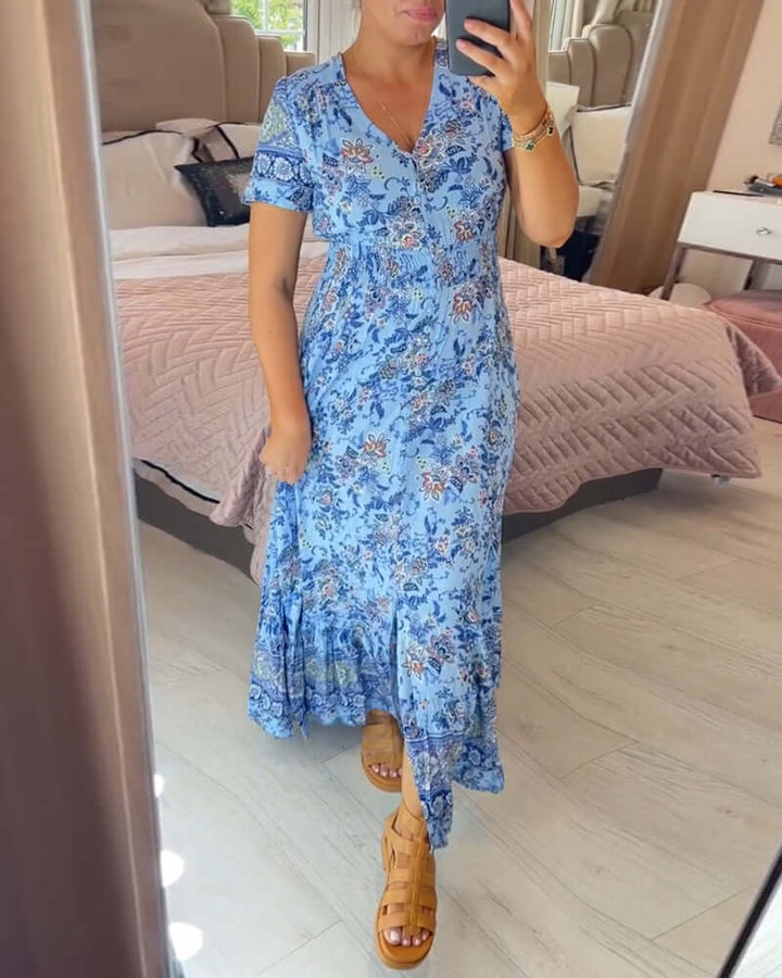 Casual women's summer dress: floral boho maxi with V-neck and short sleeves, ideal for beach vacation attire.