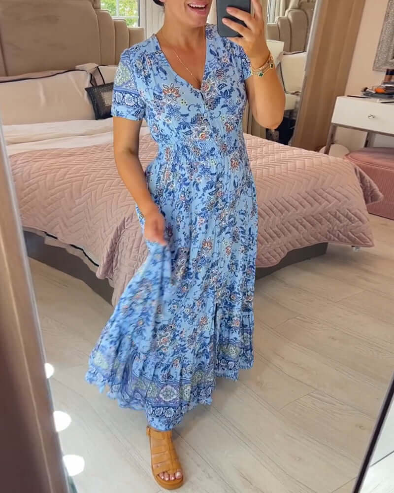 Elegant flowing women's floral boho maxi dress with V-neck, short sleeves, perfect for summer vacation.
