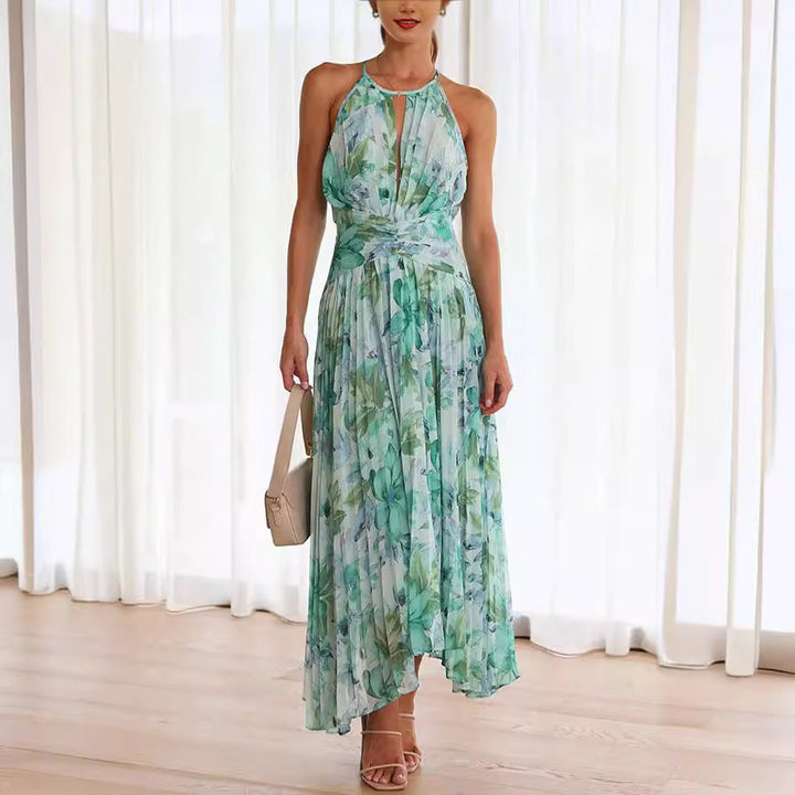 Women's floral halter midi dress, perfect for a wedding guest or special occasion. Elegant pleated design.