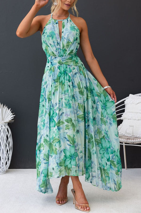 Formal women's wedding guest dress: floral pattern, halter neckline, midi length, with elegant pleats.
