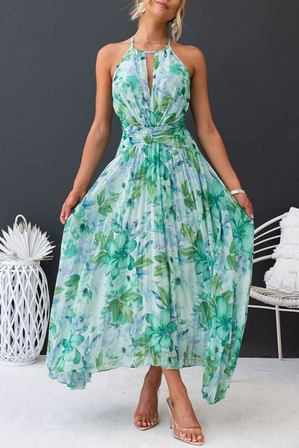Women's elegant floral halter midi dress. Perfect party or formal wedding guest attire with pleated skirt.