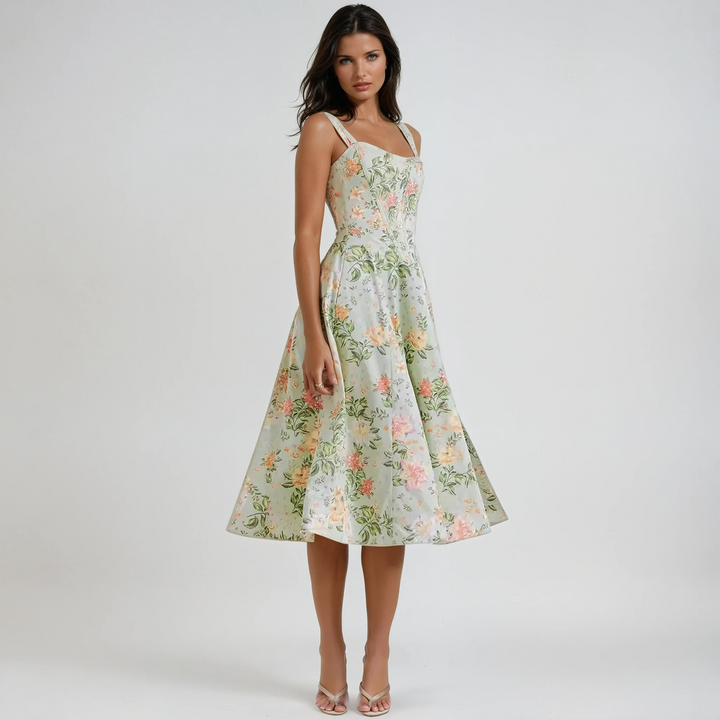 Women's floral midi party dress, elegant sleeveless design for summer occasions.