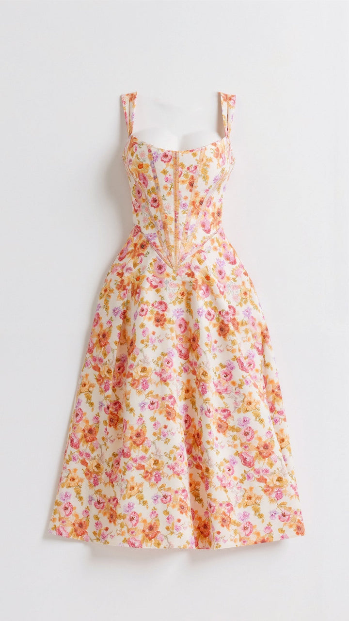 Chic women's floral midi party dress, sleeveless design with vibrant green and orange patterns.