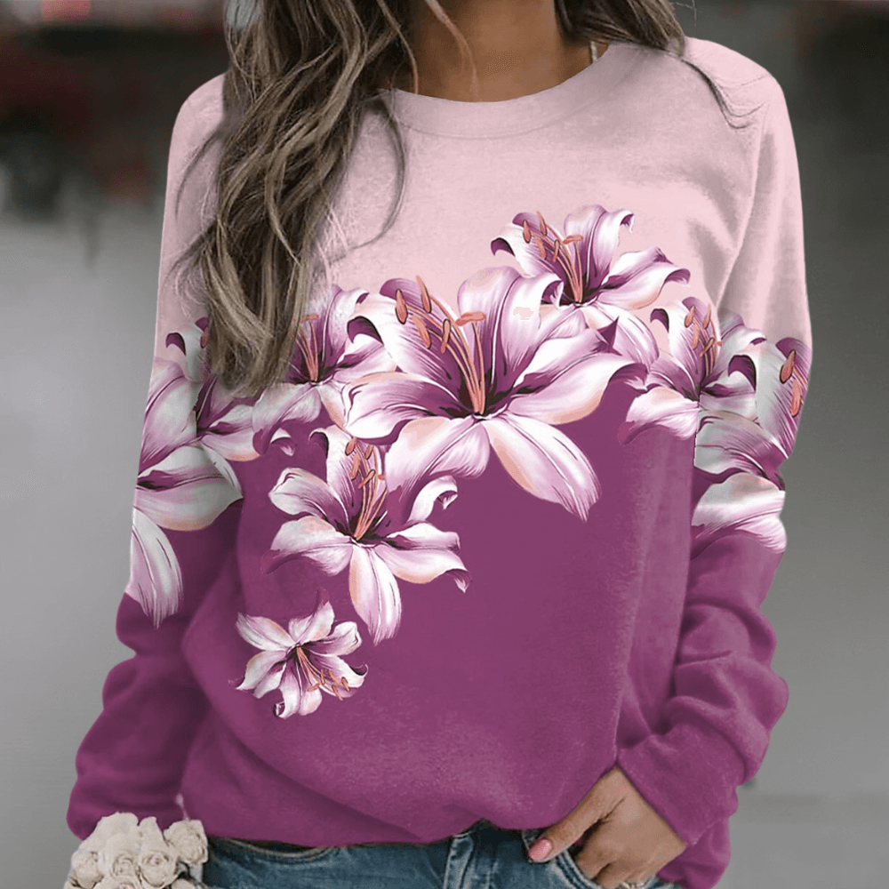 Women's floral print sweatshirt, relaxed fit, soft, versatile for casual spring fashion or everyday wear.