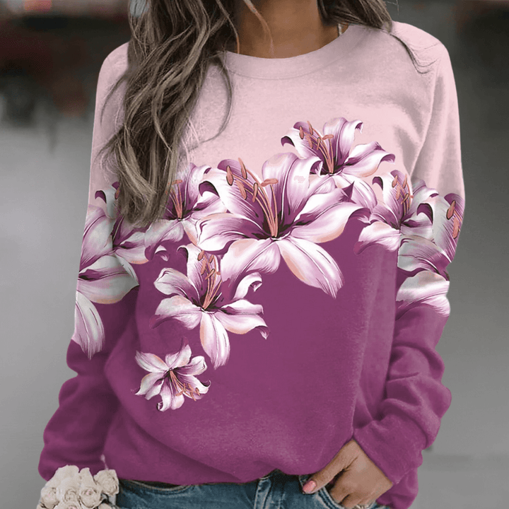 Women's floral print sweatshirt, relaxed fit, soft, versatile for casual spring fashion or everyday wear.