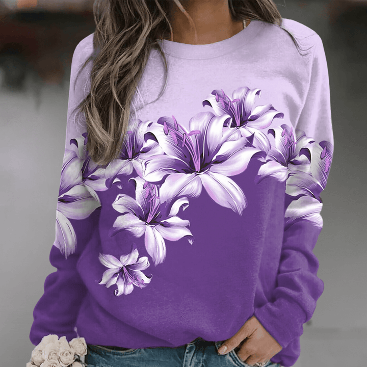 Fashionable women's floral print long sleeve sweatshirt, relaxed fit, soft fabric, comfortable spring top.