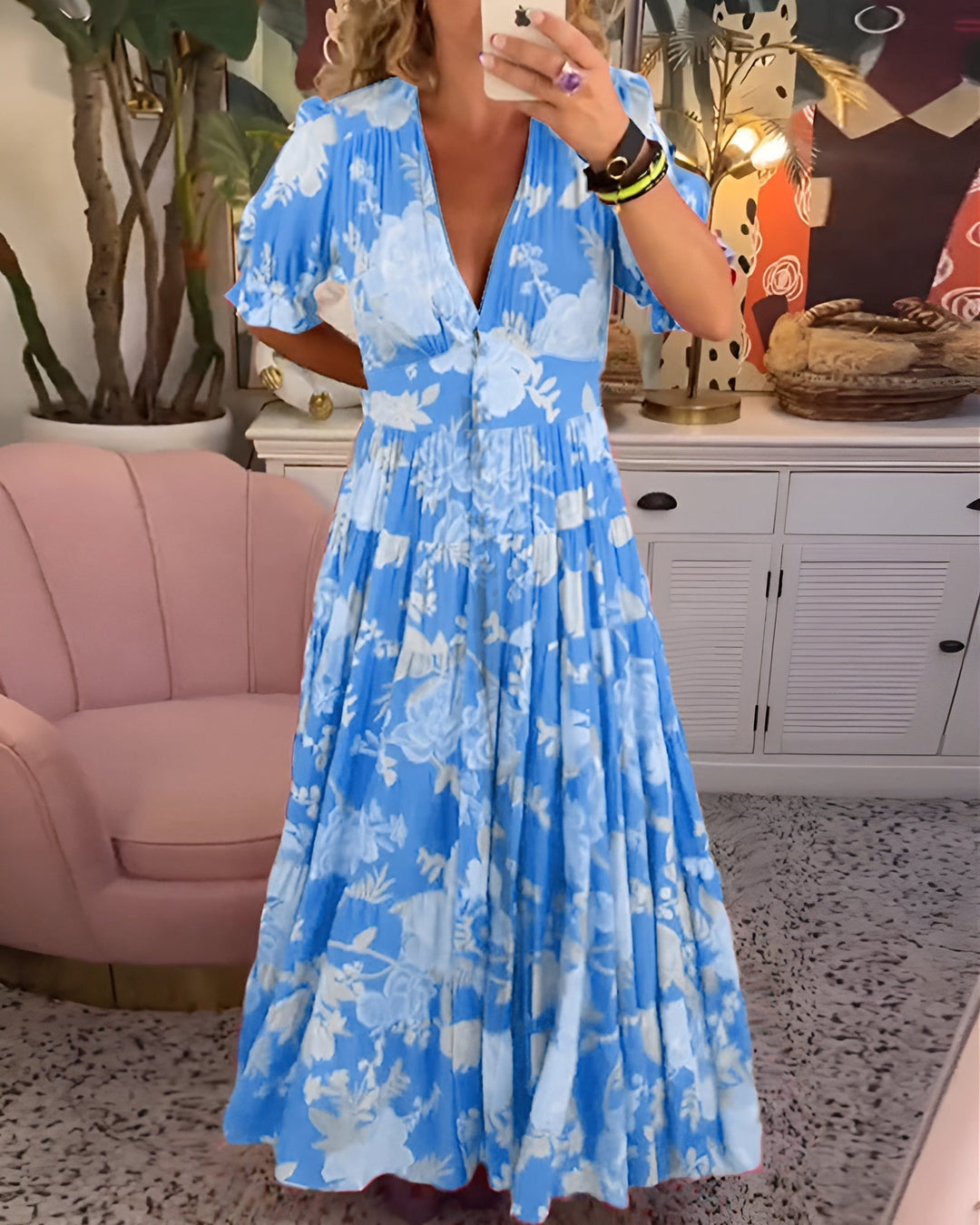 Flowing women's V-neck floral dress, comfortable & elegant for any casual summer occasion.
