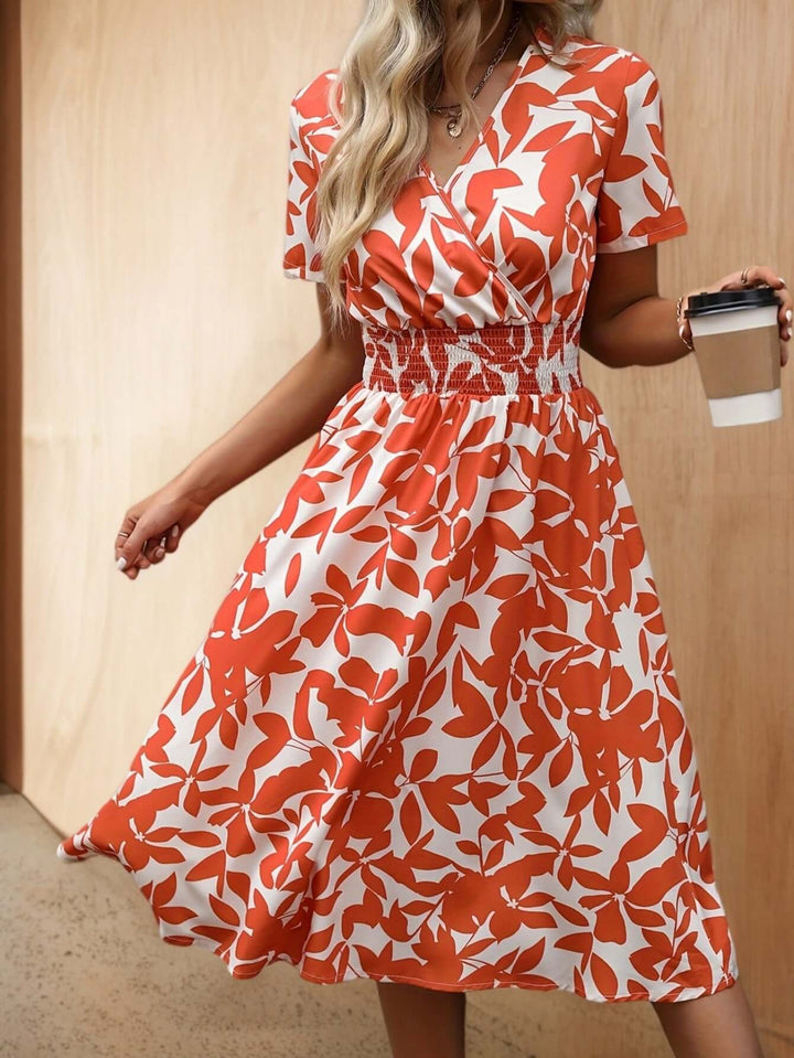 Women's floral smocked midi dress, perfect for spring & summer. Elegant, comfortable & flowy casual style.